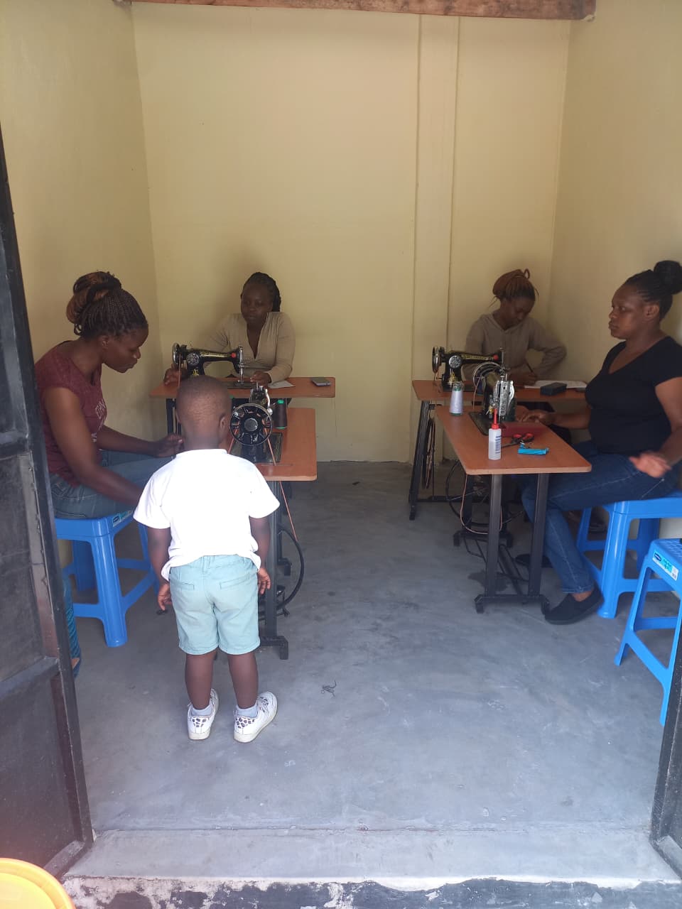 Handover of sewing machine to graduate